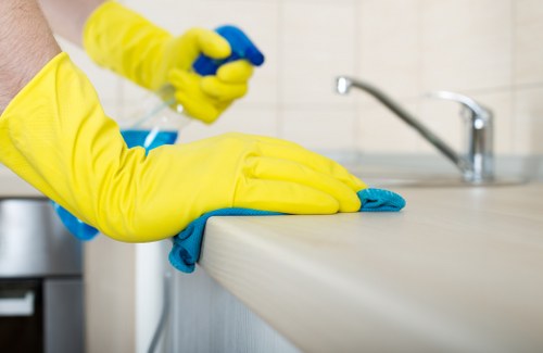 Technician applying safe upholstery cleaning treatment