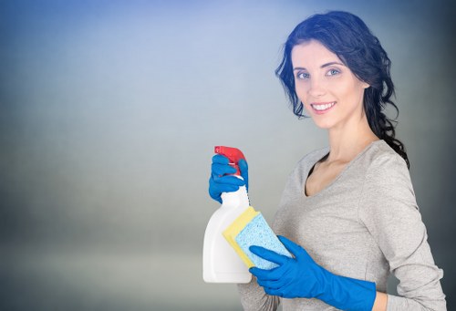 Professional carpet cleaner in Cricklewood explaining safety procedures before work